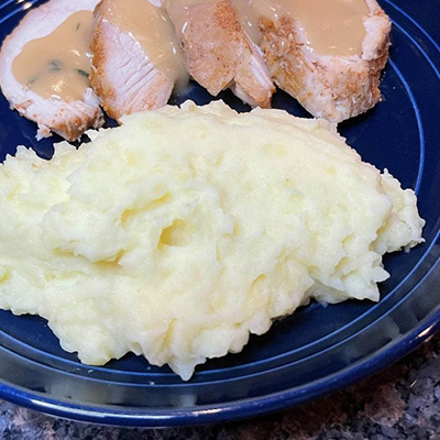Garlic mashed potatoes, prepared on plate.