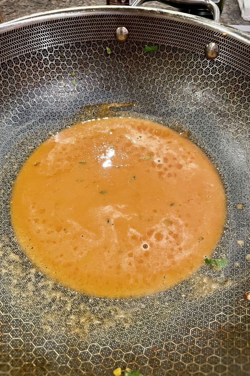 Thai peanut sauce, cooking in pan.