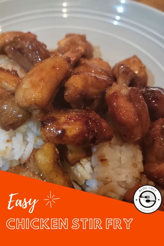 Close up of chicken stir fry on rice.