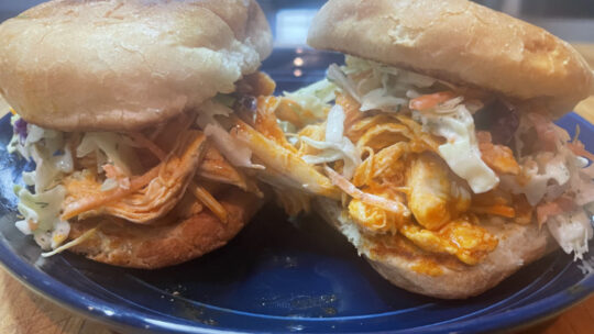 Close up view of buffalo chicken sliders.
