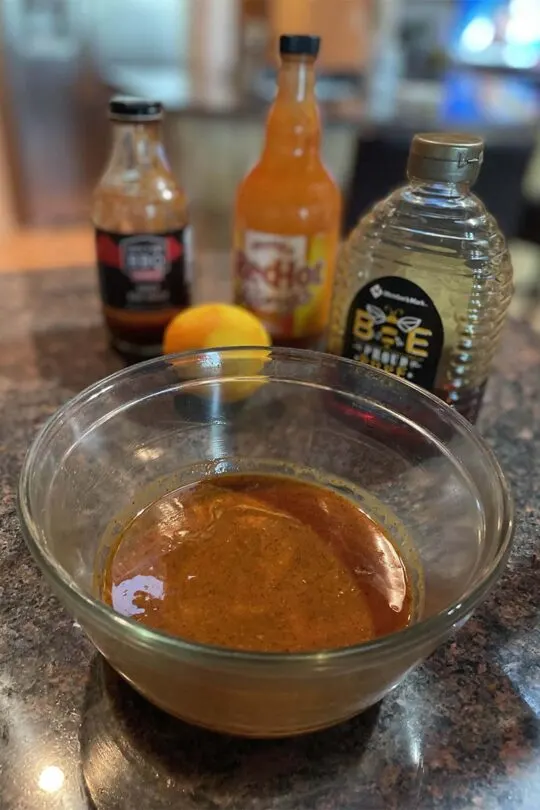 Glaze and ingredients for honey mustard grilled chicken wings.