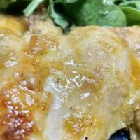 Baked chicken thighs recipe, prepared for serving.
