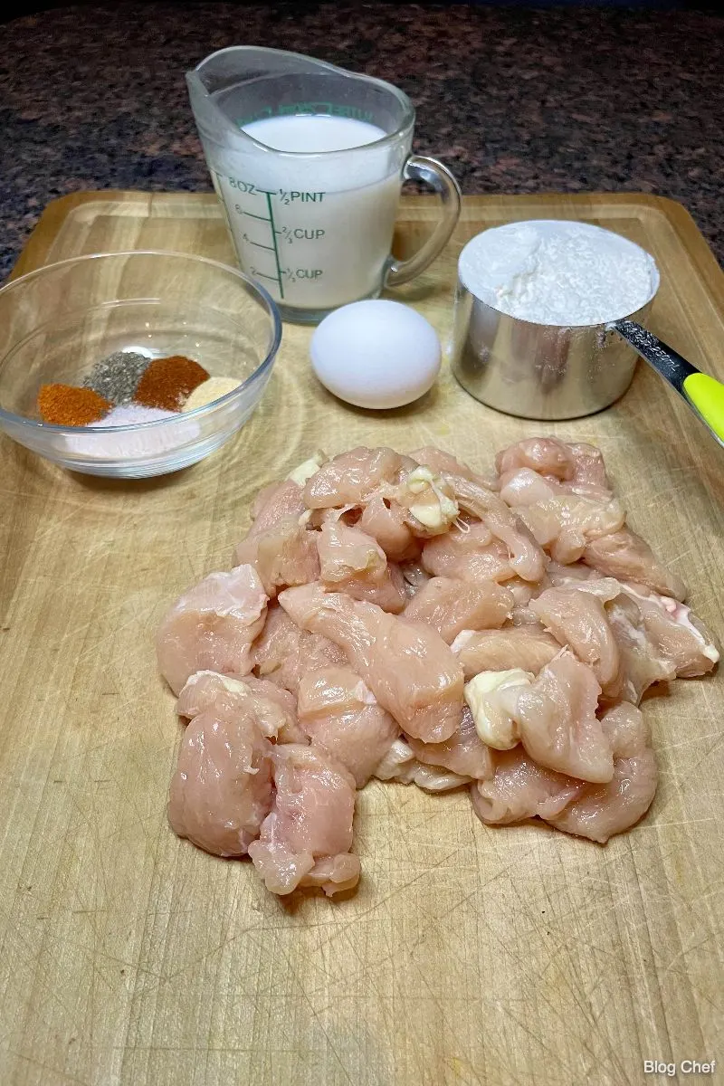 Ingredients for lemon pepper boneless wings arranged on cutting board.