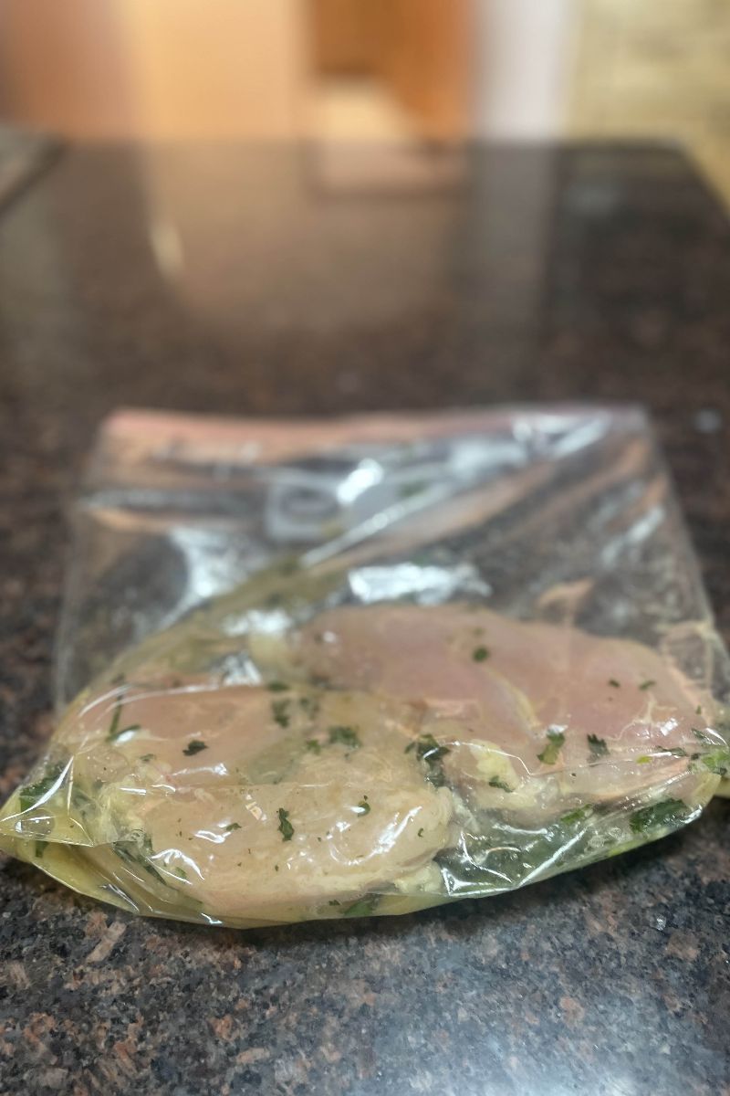 Chicken breast marinating for grilled chicken with pineapple avocado salsa.