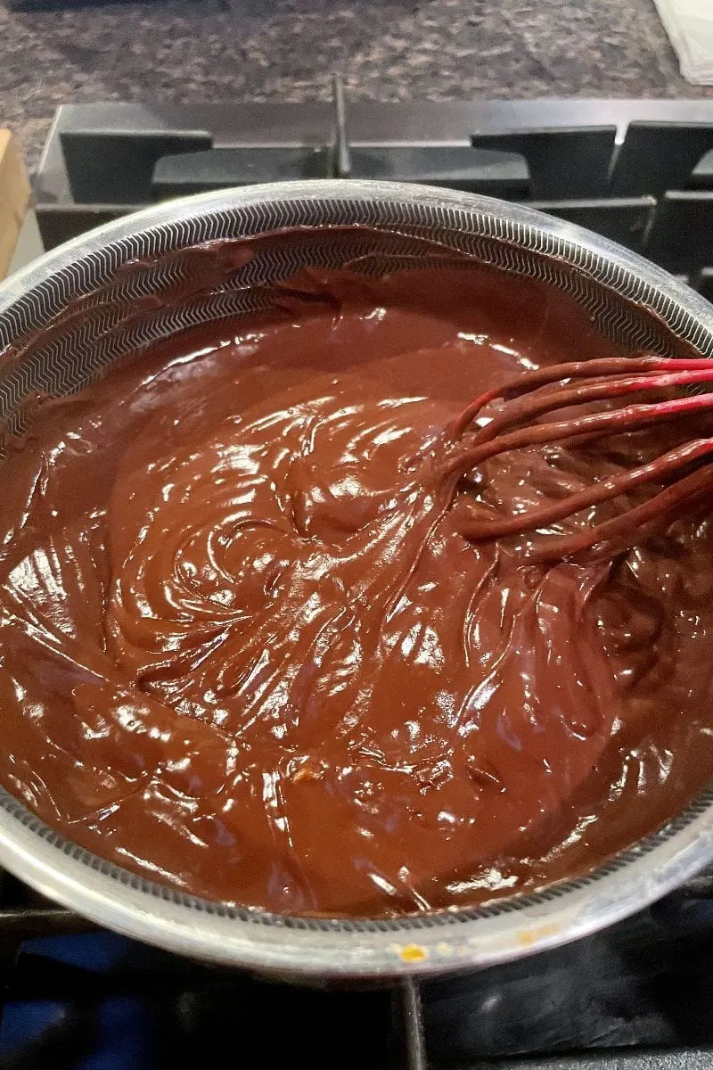 Chocolate pie filling in saucepan.