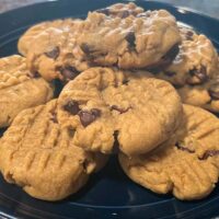 Chocolate chip peanut butter cookies, prepared on plate.