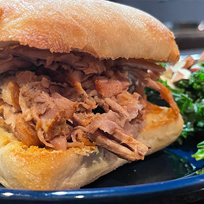 Close up view of pulled pork sandwich.