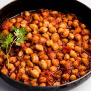 Top view of seasoned garbanzo beans in a skillet.