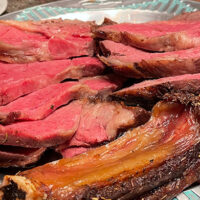 Close-up view of sliced prime rib cooked to medium rare.