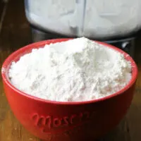 Powdered sugar in red bowl.