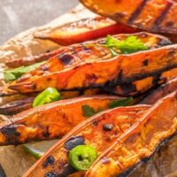 Grilled sweet potatoes on tray.