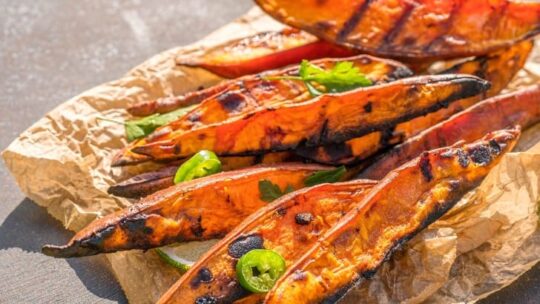 Grilled sweet potatoes on tray.