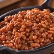 Baked beans in cast-iron skillet.