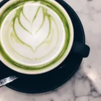 Top view of matcha latte in cup to represent what does matcha taste like at Starbucks?