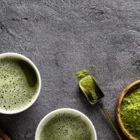 Matcha tea and powder on table to represent what does matcha taste like?