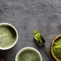 Matcha tea and powder on table to represent what does matcha taste like?