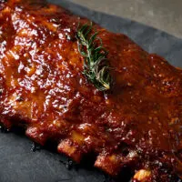 Cooked spare ribs on platter.