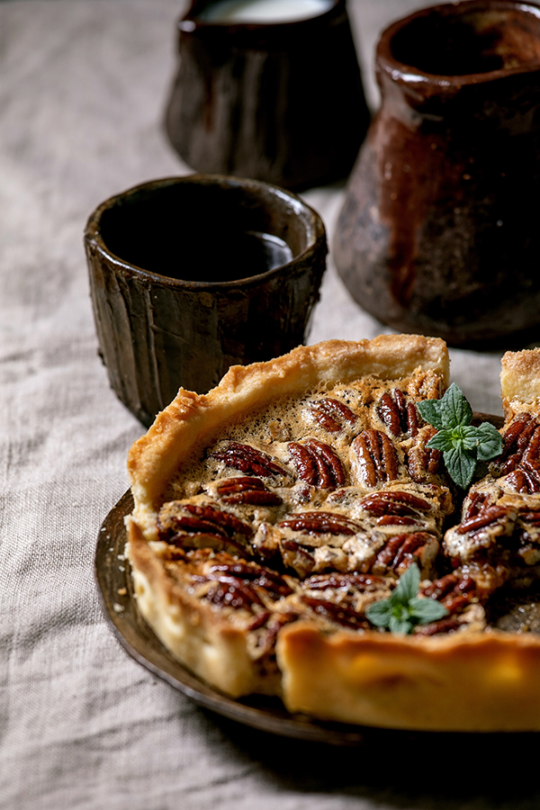 Pecan pie on table, one of our friendsgiving food ideas.