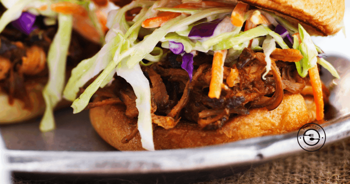 Close up of pulled pork slider with text overlay that reads, the best slider recipes.