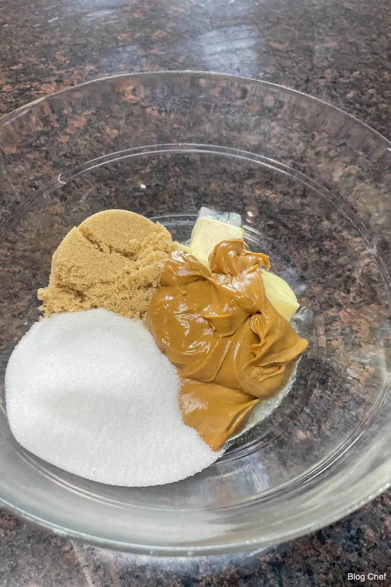 Ingredients for peanut butter cookie dough in bowl.